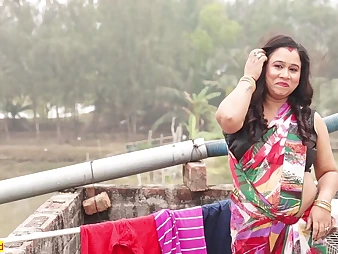 Watch this Indian cutie with a wondrous body take it hard in doggy-style on the rooftop