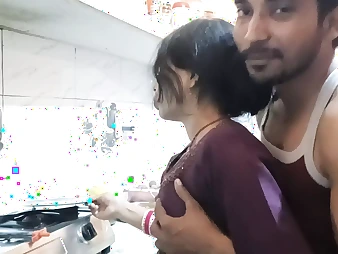 Steamy Indian teenage with big tits gets frisky in the kitchen with her boyfriend